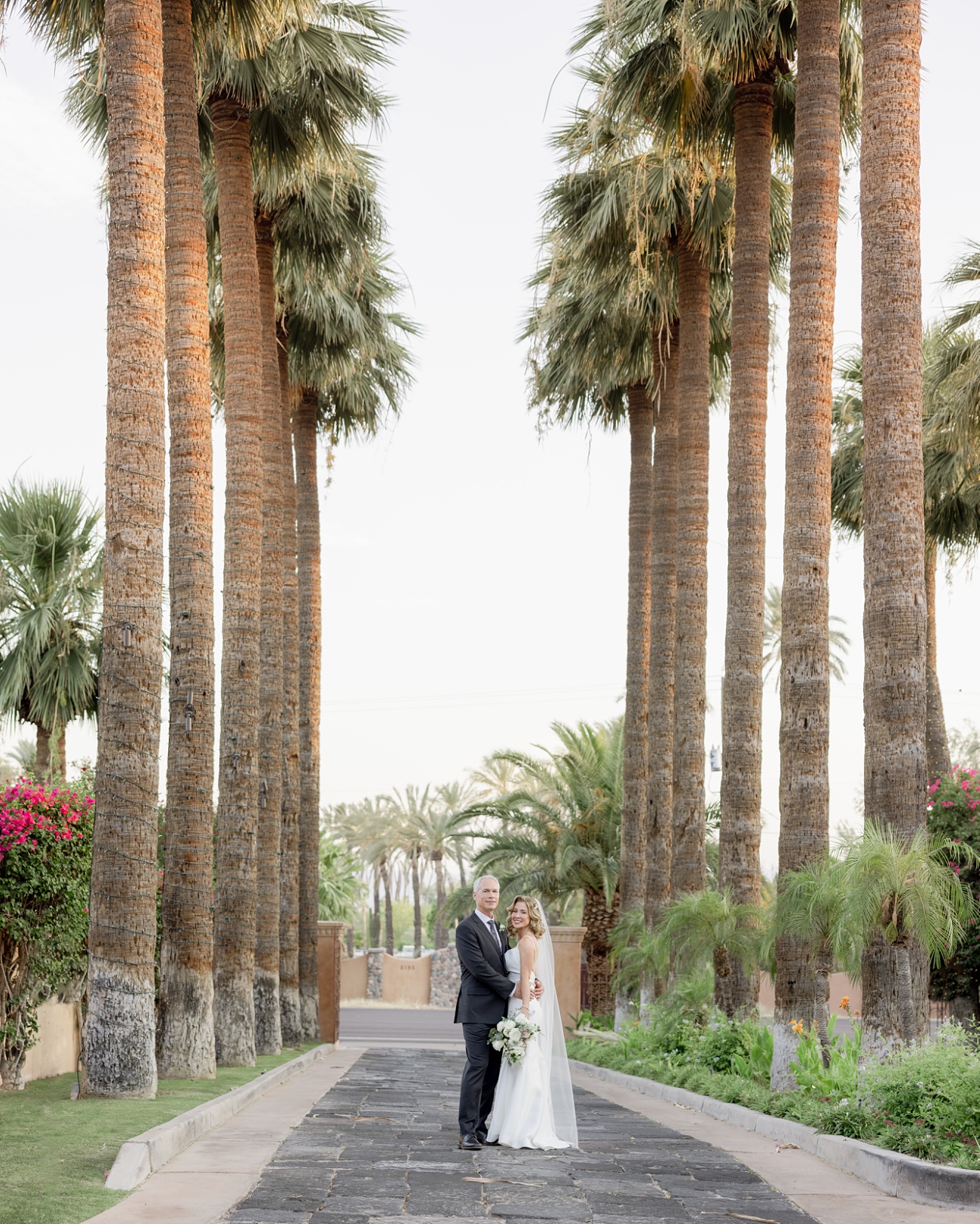 Couple under the palms at the Royal Palms Resort and Spa