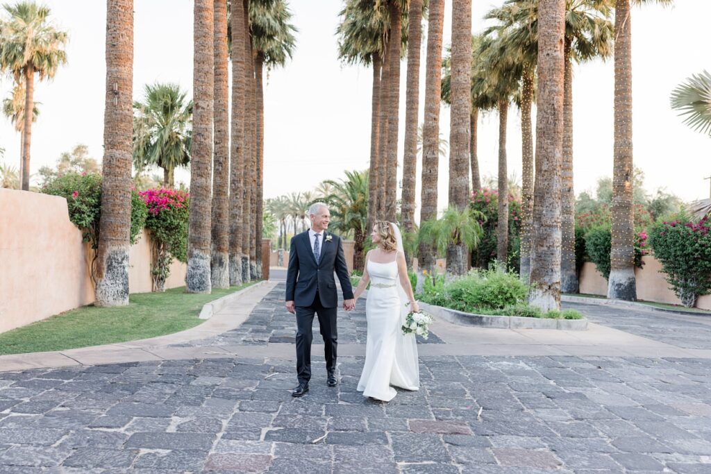 Couple under the palms at the Royal Palms Resort and Spa